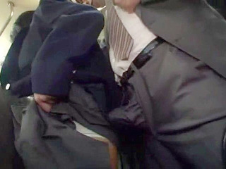Hot and bothered - Naughty Japanese schoolgirl grabs businessman's dick on crowded Tokyo bus.